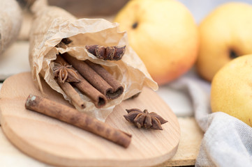 Ingredients for Roasting Pears with  cinnamon and anise stars on a wooden background with burlap...