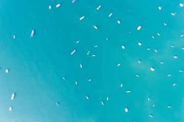 Top view aerial drone shot of sailing boats in tropical sea.