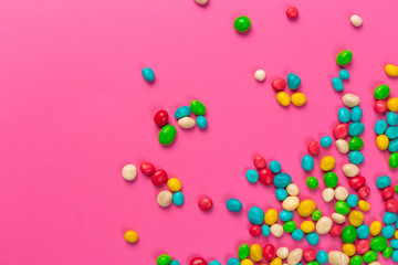 Colorful lollipops on a pink background