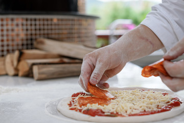Concept picture of home made pizza making with fresh ingredient