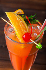 glass of delicious alcoholic cocktail on dark background