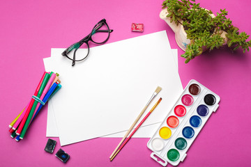 Top view of  Watercolor Painting Supplies, Brushes and Colorful Pencil. Creation process of watercolor painting. Copy space.