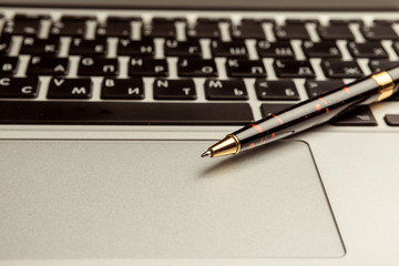 Top view of modern  laptop on wooden desk