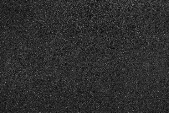 Black smooth asphalt road texture background top view