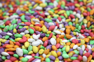 Fototapeta na wymiar Sunflower seeds in sugar glaze. Colorful candies background