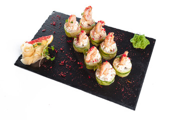 Black rectangle plate with sushi, isolated on white