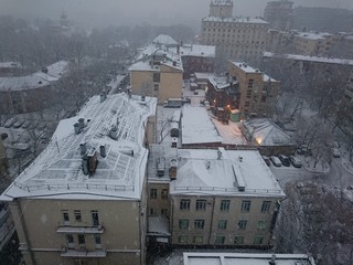Snowing in Moscow view from the roof the district of Chamovniki