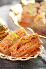 Delicious baklava dessert in oriental golden setting