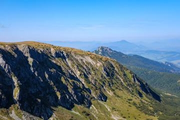 mountain top panorama in  autumn covered in mist or clouds