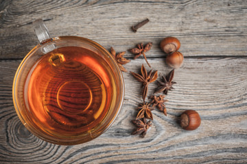 aromatic hot cinnamon tea on wooden table