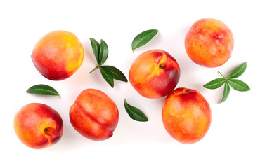 ripe nectarine with leaves isolated on white background. Top view. Flat lay pattern