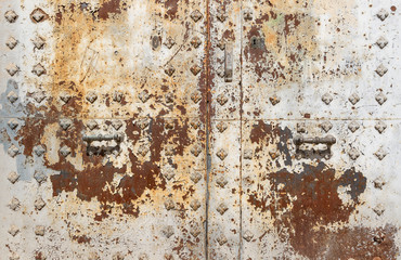 handle and lock of an ancient rusty metallic door