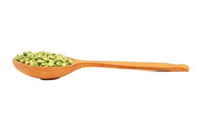 Dry green peas in spoon
