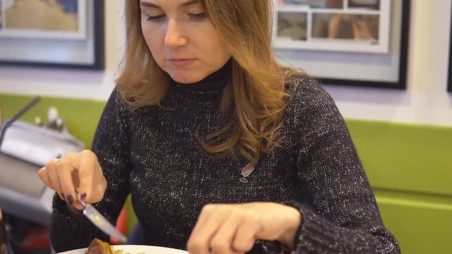 Beautiful women eating in cafe