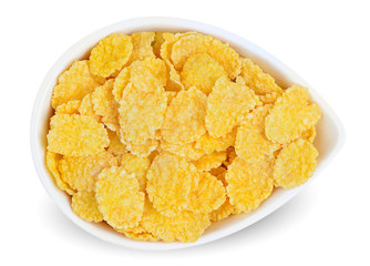 Isolated corn flakes. Bowl of corn flakes isolated on white background with clipping path. Top view.