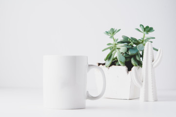 white mug mockup in a styled setting with a white background