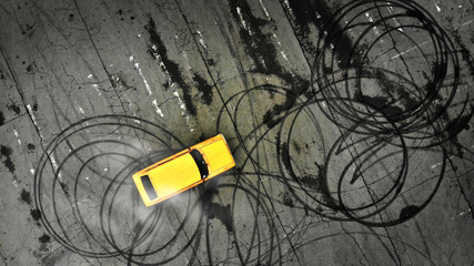 Car drifting. Professional driver drifts a yellow car on a parking lot. Aerial view from above.