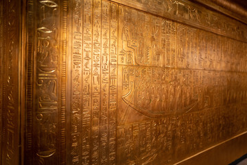 Tomb of ancient Egyptian pharaoh king Tutankhamen covered with carved out hieroglyphs