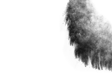 particles of charcoal on white background,abstract powder splatted on white background,Freeze...