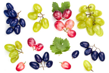 green pink and blue grapes with leaves isolated on the white background. Top view. Flat lay pattern