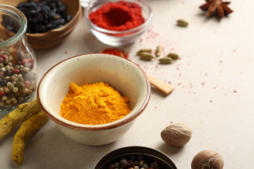 Curry powder in bowl and other spice
