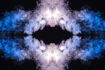 Abstract thick colored smoke on a black background with a monster face. The concept of light laser show at a musical concert and a print on a T-shirt