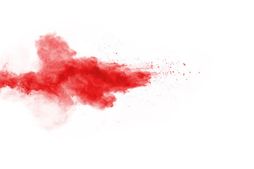 Freeze motion of red powder exploding, isolated on white background. Abstract design of red dust cloud. Particles explosion screen saver, wallpaper
