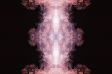 Abstract thick colored smoke on a black background with a monster face. The concept of light laser show at a musical concert and a print on a T-shirt