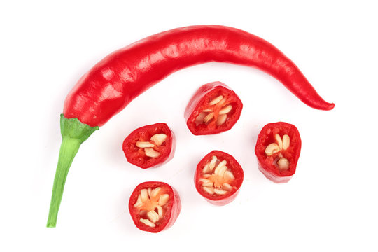 sliced red hot chili pepper isolated on white background. Top view. Flat lay pattern