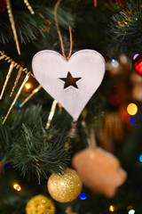 Christmas decor close-up, New Year's interior details, Christmas tree, balls on the branches, toys, candles, sock