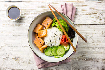 Hawaiian salmon poke bowl with seaweed and avocado