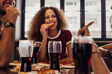 Woman with friends enjoying a meal