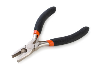 Metal pliers with black and red dielectric handles isolated on white background, close up.