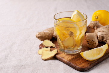 detox and diet ginger drink with lemon in glass