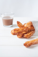 Churros and chocolate sauce traditional spanish street food