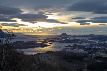 View from a hill outside the city towards the town and the mountain Torghatten; County of Nordland