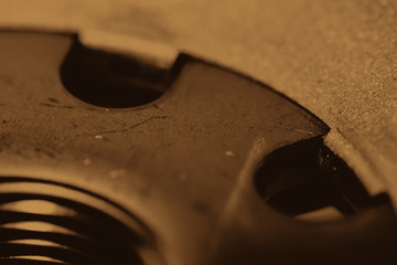 Monochrome background image of oil filter close up. Artwork from auto part in macro photography in sepia tones.