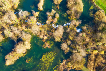 Croatia, Mreznica river from air, top down view, Karlovac county, green nature, beautiful waterfalls in autumn