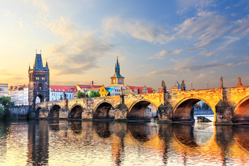 Fototapeta na wymiar Charles bridge over Vltava river in Prague at sunrise