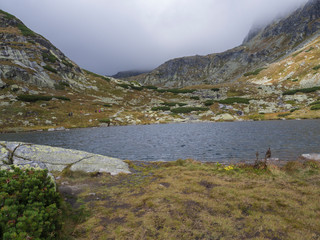 Pleso nad Skokom, beautiful mountain lake in Mlynicka Dolina Valley with hiking peoples on footpath High Tatras mountain, Vysoke Tatry , Slovakia © Kristyna