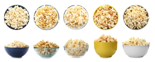 Gordijnen Set with bowls of tasty popcorn on white background © New Africa