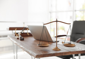 Scales of justice on desk in notary's office
