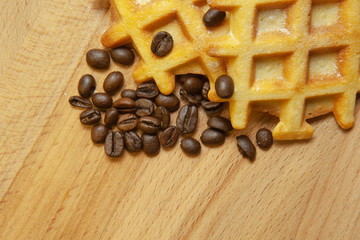 Tasty fresh Vienna wafers, grain coffee on a wooden background, copy space