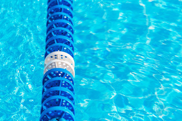 Swimming pool water with blue lane marker