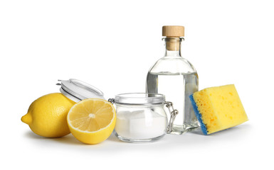 Composition with vinegar, lemons and baking soda on white background. House cleaning