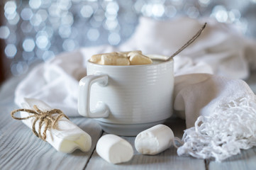 A cup of cocoa and marshmallow in the New Year's Christmas table