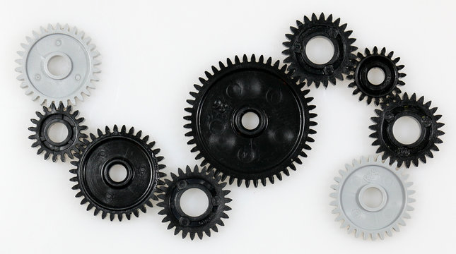 Several gears that are in connection with each other on a white background