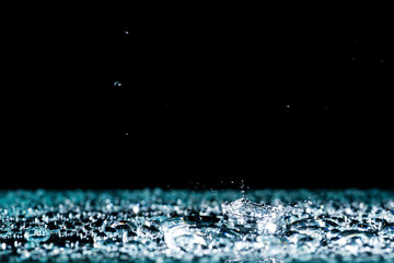 Naklejka na ściany i meble water drops on the surface background rain splashing water crown