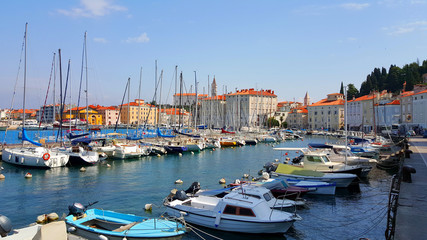 Jetty for mooring fishing boats and yachts on the Mediterranean coast at dawn. Piran, Slovenia