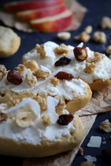 Bruschetta with ricotta cheese and granola cereals over dark blue background